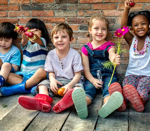 Children enjoying outdoor play at Quokka Kids in Beaver Dam, WI, promoting play-based learning.